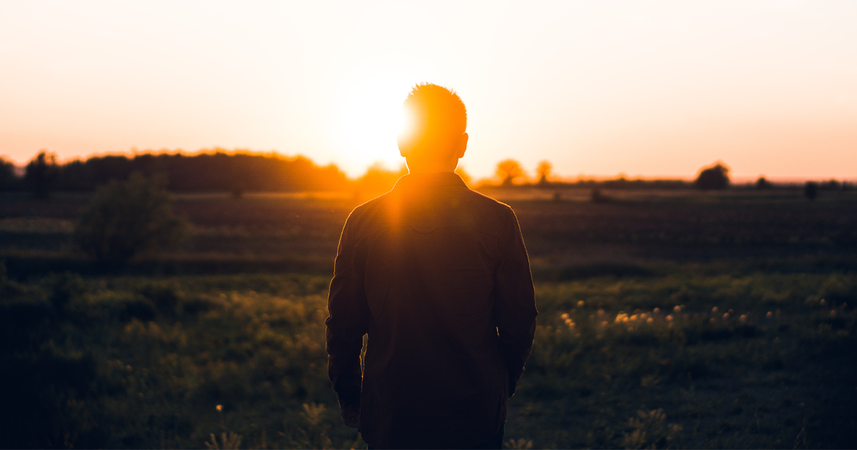 man standing in field