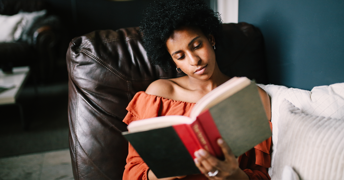 Young woman reading book.