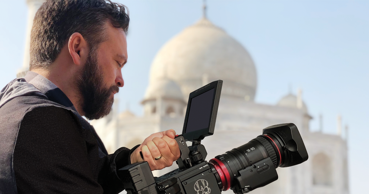 Daniel Kennedy holding a camera.